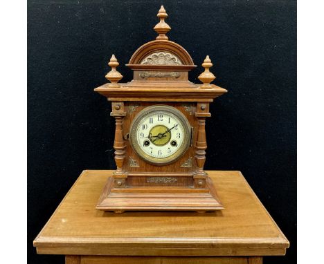 Junghans mantel clock, cream dial, Arabic numerals, twin holes, 40cm high; a small  Edwardian walnut card table, 72cm high (2