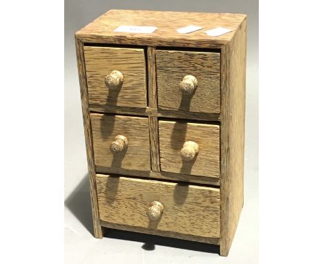 A partridge wood miniature bank of drawers