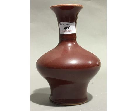 A Chinese porcelain red ground vase