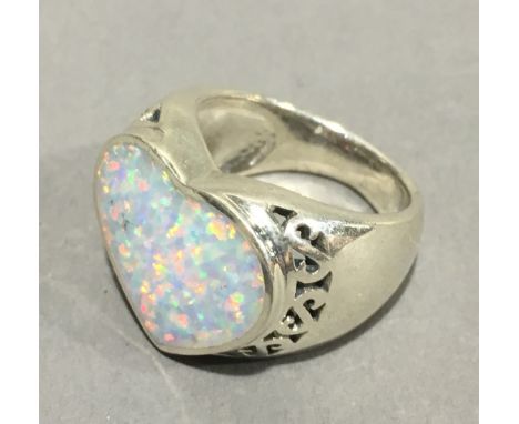 A silver and opal heart ring