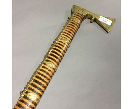 An unusual Chinese brass mounted zebra/tiger wood walking stick