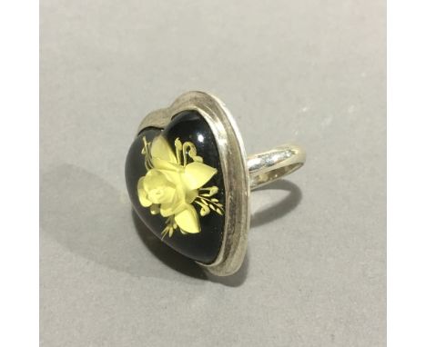 A silver heart shape ring