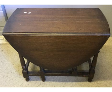 An early 20th century oak gate leg table