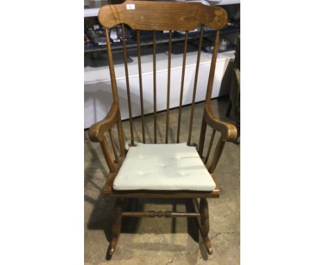 A beech stick back rocking chair