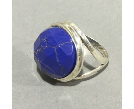 A silver and lapiz ring