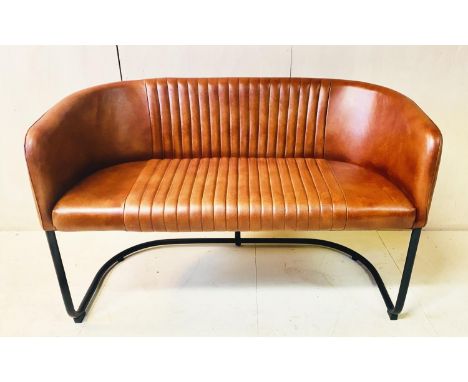 SOFA, 76cm high, 116cm wide, 55cm deep, tan upholstery, ribbed finish, black tubular frame. 