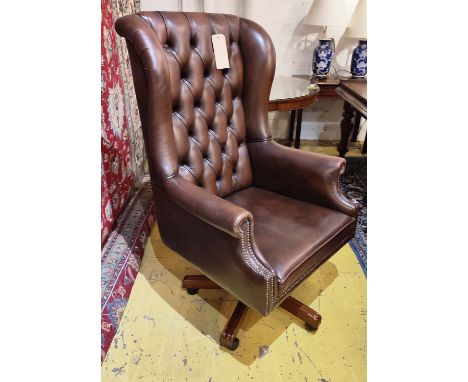 WINGBACK SWIVEL DESK CHAIR, 76cm x 126cm H, in button back leather. 