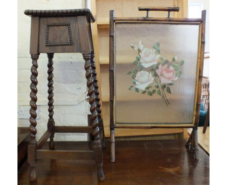 An Oak barley twist plant stand and bamboo glazed and painted firescreen and a stained folding armchair