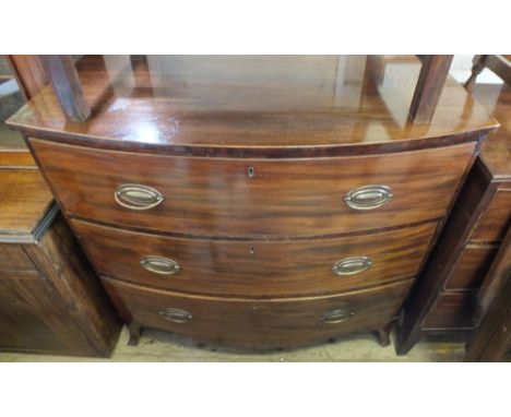 A Mahogany bow fronted chest of three drawers on bracket feet