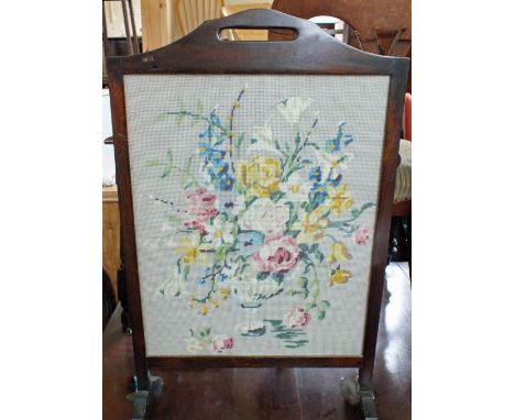 Three woolwork screens and a tapestry top table