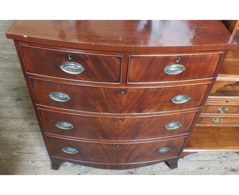 A Victorian bow fronted Mahogany chest of two short and three long drawers on bracket feet