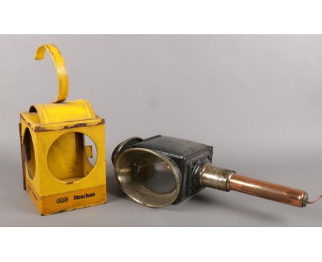 An antique carriage lamp along with a Strachan railway lamp.  