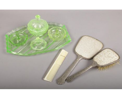 A uranium glass bedroom set along with a dressing table set (mirror, brush, comb).  