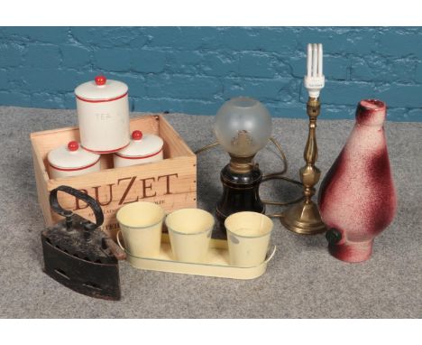 A box of miscellaneous. Includes French oil lamp, storage jars, brass lamp etc.  