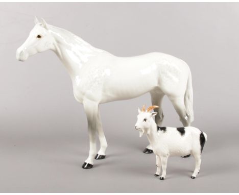Two ceramic figures. A large Beswick dapple grey horse (29cm height) &amp; a Royal Doulton Goat figure (14cm height).  