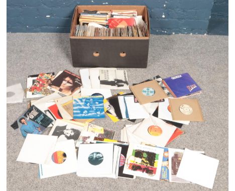 A box of single records. Including Queen, Rolling Stones, Madness, U2, Motown, ABBA, etc.  