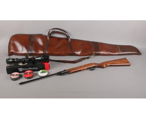 A cased Diana break barrel air rifle. Model no 23 177. To include a boxed Nikko Sterling Scope 4-12x50 AO, and three empty pe