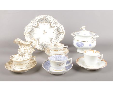 A collection of Rockingham pottery. Four various cups &amp; saucers, plate (26.5cm diameter), small jug, lidded tureen.  