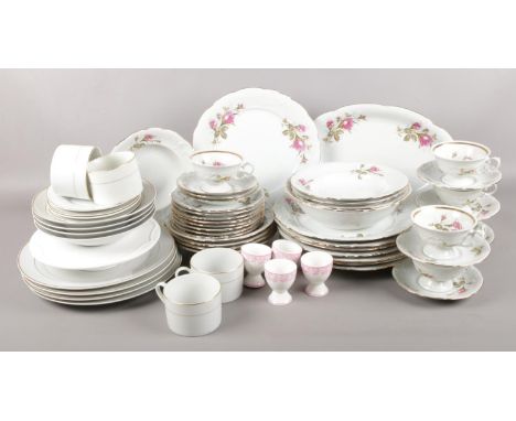 Two ceramic part dinner wares. Serving plate, 8 soup dishes, 8 dessert plates, 8 dinner plates, serving bowl, 6 cups &amp; sa
