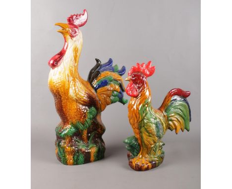 Two Majolica style ceramic cockerels. Largest: H:53.5cm, W:29cm.  