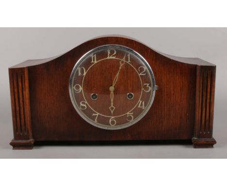 A Mahogany Art Deco style mantle clock. Dial engraved Foreign, in working order.  