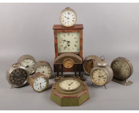 A box of clocks. Including Wurttenburg mantel clock, The Tattoo Intermittent alarm clock, etc.  