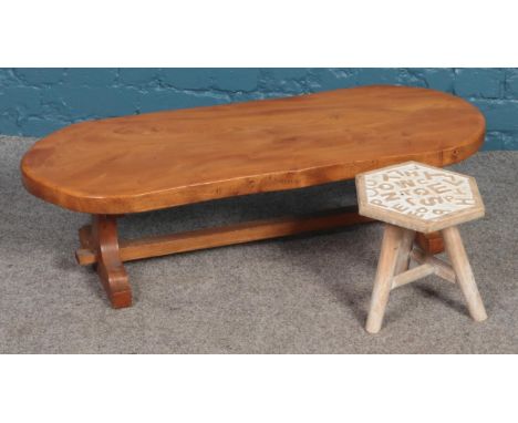 A low hardwood coffee table/bench, together with hexagonal 'alphabet' tripod stool.  