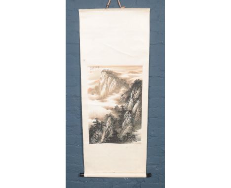 A large silk mounted Chinese watercolour scroll painting of a landscape. Chinese markings to the top left on image.Full lengt