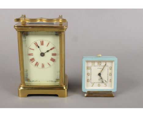 A Jaeger LeCoultre Alarm Clock, with square blue dial and Arabic numerals (6.5cm high), together with an unmarked brass carri