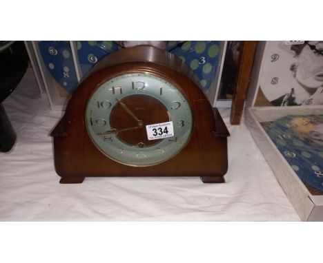 A 1930's oak mantle clock