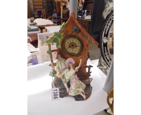 A bisque porcelain mantel clock.