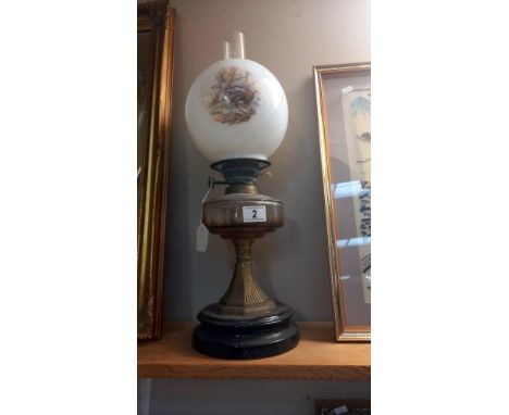 A Victorian oil lamp with later shade