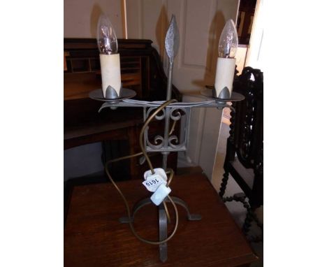 A two light metal table lamp.