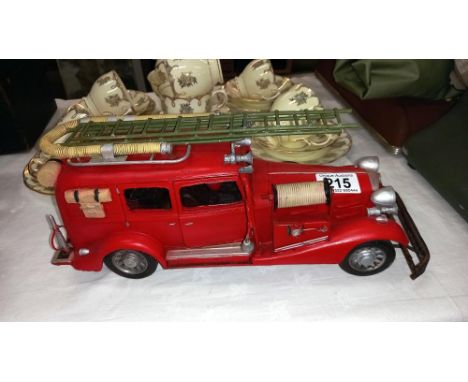 A large pressed steel and fibre glass model of a vintage American fire engine length 36cm