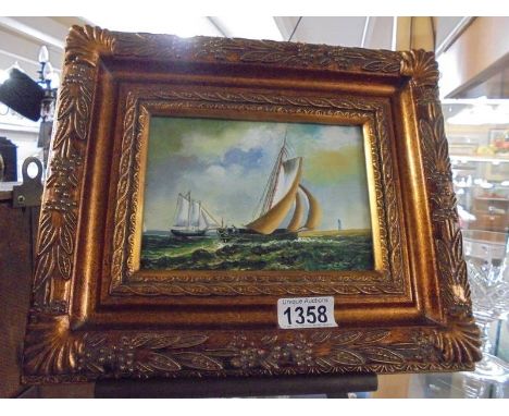 A gilt framed seascape.