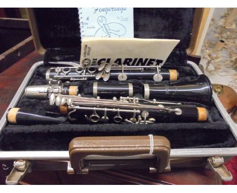 A cased Boosey and Hawkes clarinet.
