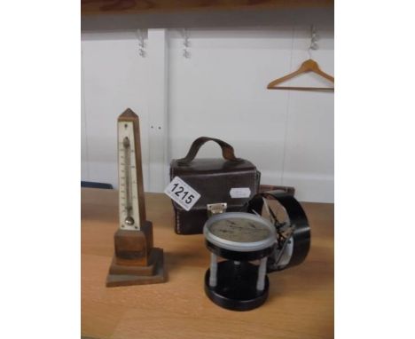 A cased air meter a/f and a thermometer.