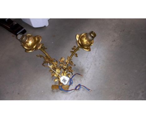 A gilded two lamp wall light