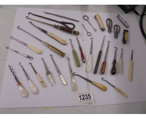 A good lot of assorted button hooks etc.,