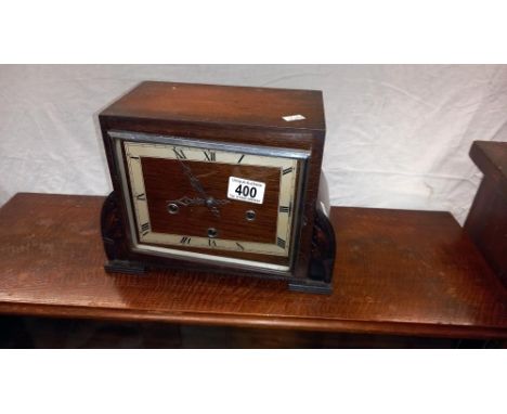 An art deco oak mantle clock