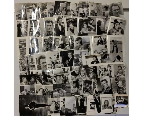 Approx 70 variously sized (most c 8x10") black and white press photographs depicting Clint Eastwood, many vintage prints with