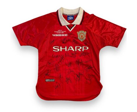 A 1999 Manchester United 'Champions League Winners' home shirt (Only Football tag, no sizing label) signed by 20+ players to 