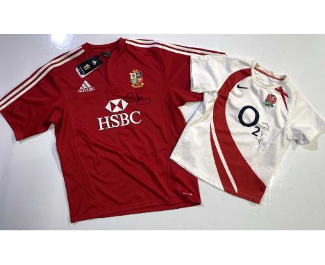 An England c 2003 rugby shirt (child's size M) signed, a British Lions 2009 shirt (L) signed by Gethin Jenkins.