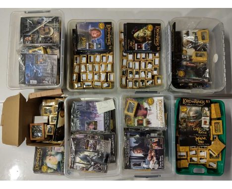 Eight boxes with a large quantity of Lord of the Rings collectables.