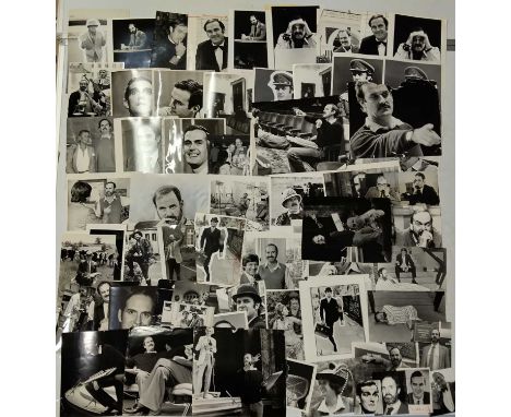 Approx 60 variously sized (most c 8x10") black and white press photographs depicting John Cleese, many vintage prints with pr