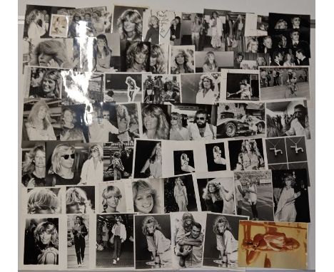 Approx 60 variously sized (most c 8x10") black and white press photographs depicting Farrah Fawcett, many vintage prints with