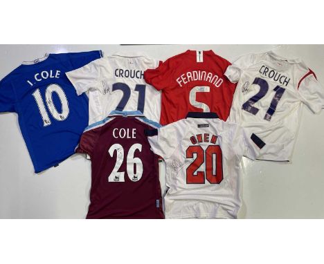 Six football shirts, each bearing a signature. To include: Chelsea shirt (S) signed by Joe Cole, two England shirt (S) signed