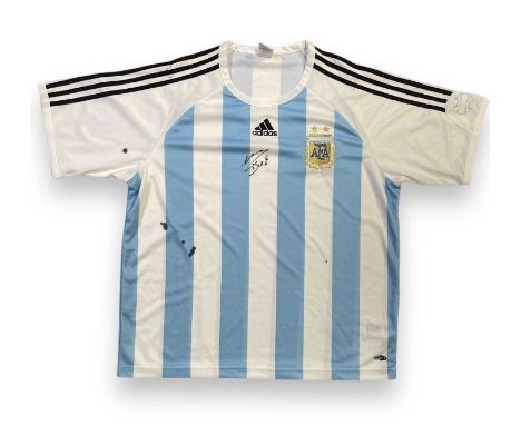 An officially produced Adidas Argentina football shirt (XL) signed in black marker pen by Diego Maradona.Signatures obtained 