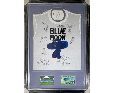 A mounted, framed and glazed display to include a Manchester City 'BeatSpills Blue Moon' t-shirt signed by 13 ex players and 