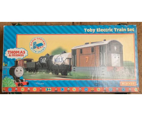 7x Hornby OO gauge Thomas the Tank Engine items. Including a Toby Electric Train Set comprising a tramcar, 4x freight wagons,